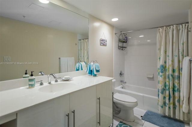 full bathroom featuring toilet, shower / tub combo, vanity, and tile patterned floors