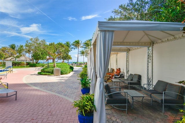 view of patio featuring a gazebo and an outdoor hangout area