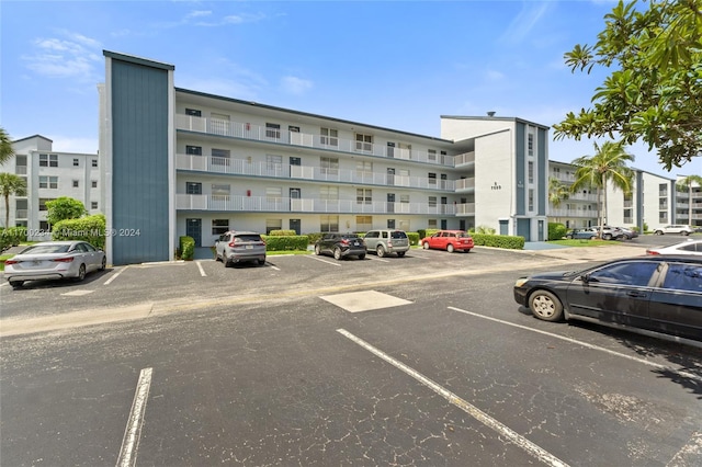 7690 NW 18th St Unit 408, Margate, FL 33063 - view of apartment building / complex with uncovered parking