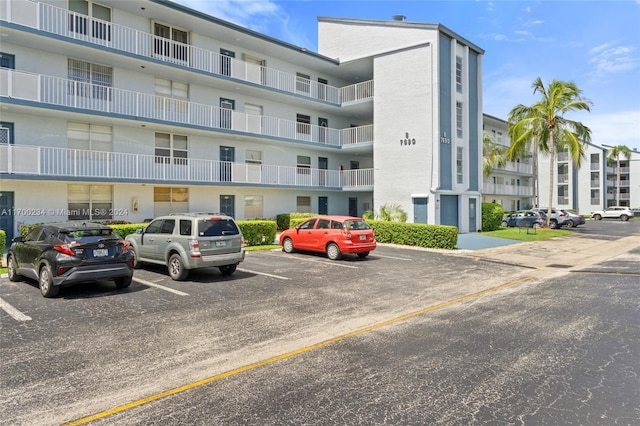 7690 NW 18th St Unit 408, Margate, FL 33063 - view of apartment building / complex with uncovered parking