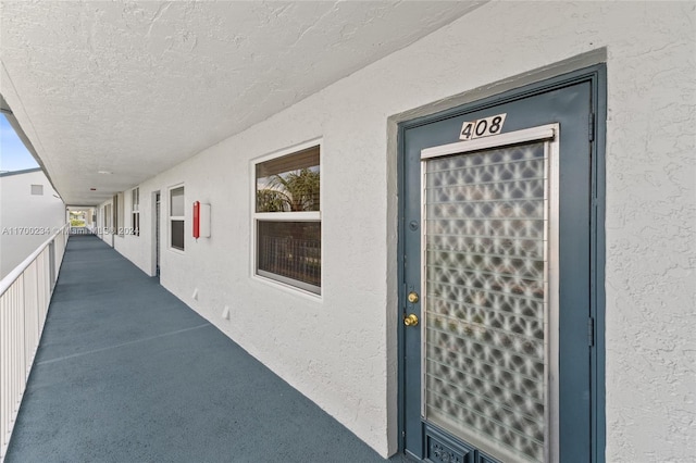 7690 NW 18th St Unit 408, Margate, FL 33063 - view of exterior entry with stucco siding