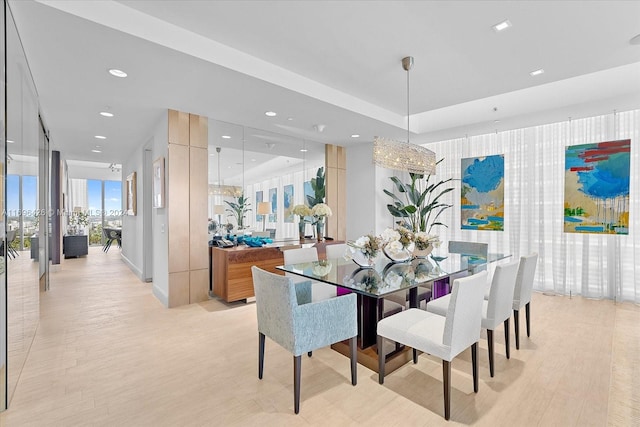 dining space with light hardwood / wood-style floors