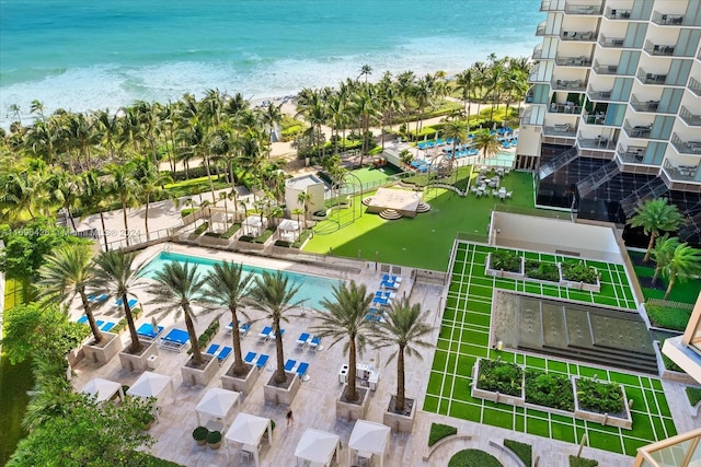 birds eye view of property featuring a water view and a view of the beach