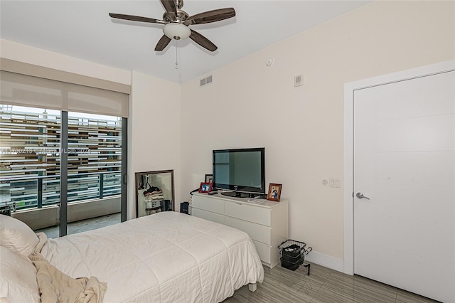 bedroom with access to outside and ceiling fan