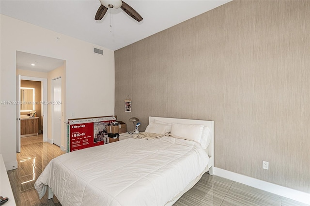 bedroom featuring hardwood / wood-style flooring and ceiling fan