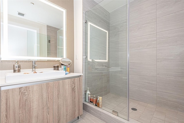 bathroom with vanity and walk in shower