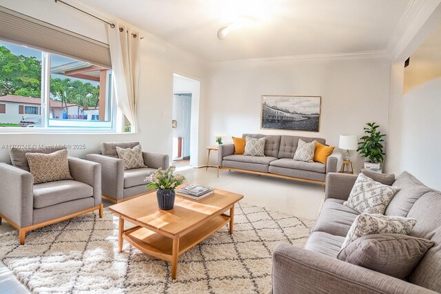 sitting room with a textured ceiling, crown molding, and light tile patterned flooring