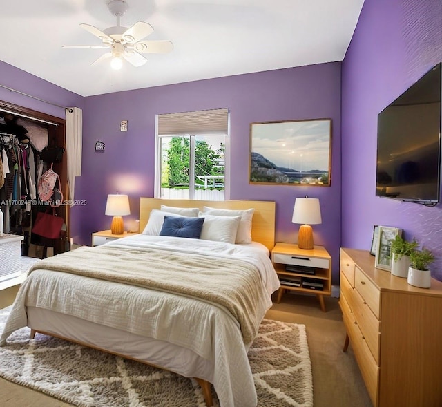 carpeted bedroom featuring a closet