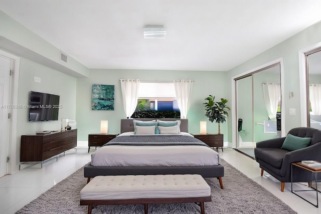 bedroom featuring visible vents and light tile patterned flooring