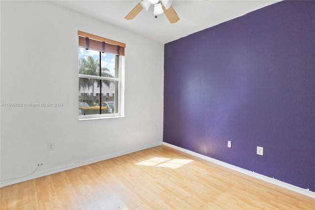 unfurnished room featuring ceiling fan and wood-type flooring