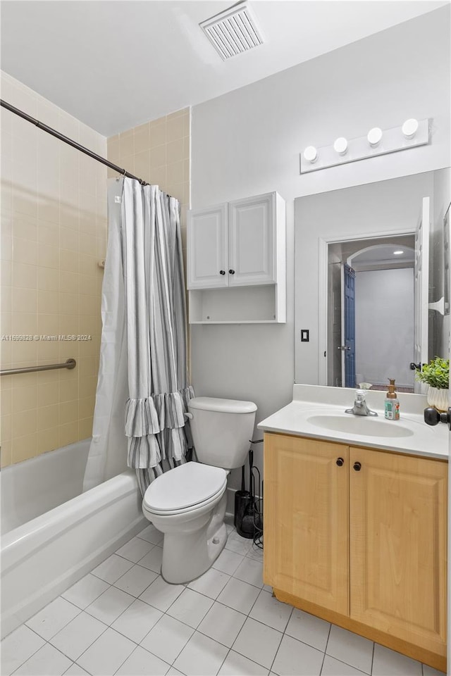 full bathroom with tile patterned flooring, vanity, toilet, and shower / bathtub combination with curtain