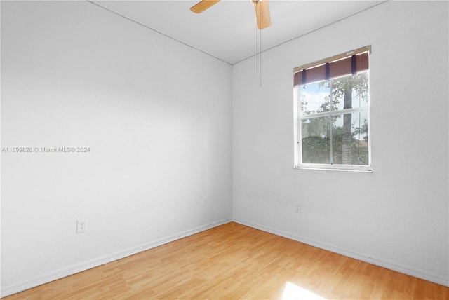 unfurnished room with ceiling fan and hardwood / wood-style flooring