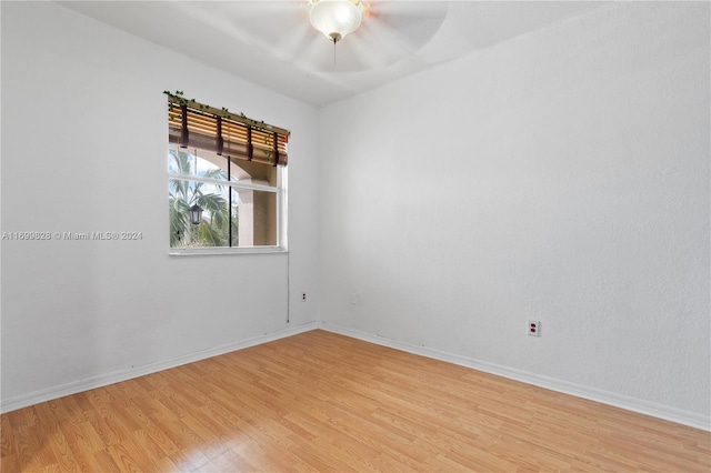 empty room with light hardwood / wood-style floors and ceiling fan