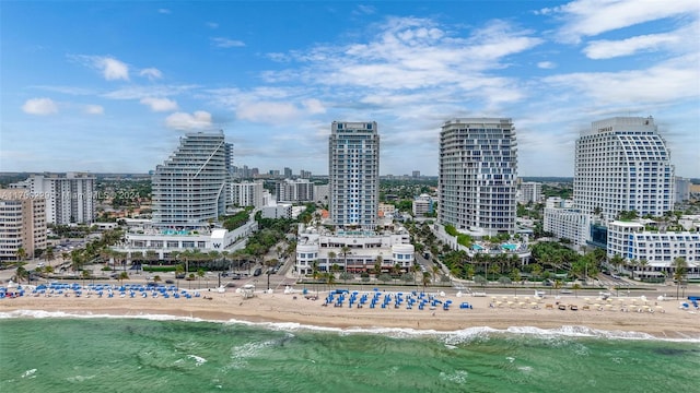 city view featuring a water view and a beach view