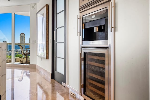 doorway featuring bar area and beverage cooler