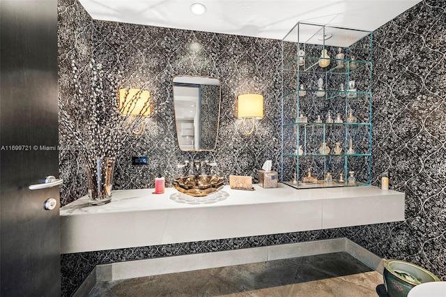 bathroom with tile patterned floors, vanity, and tile walls