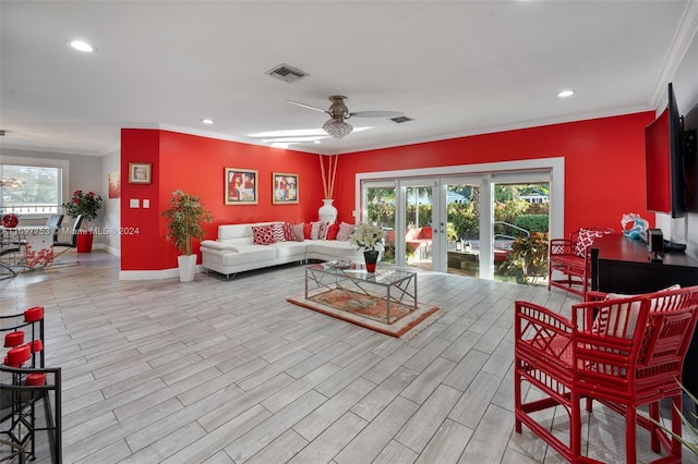 living room featuring ceiling fan, light hardwood / wood-style floors, crown molding, and french doors