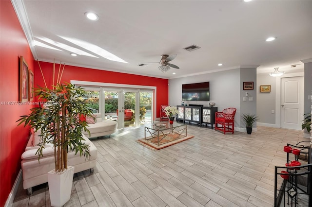 interior space with ceiling fan, light wood-type flooring, crown molding, and french doors