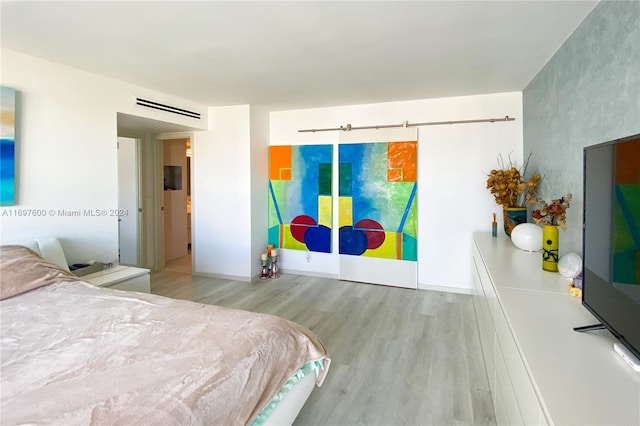 bedroom with wood-type flooring