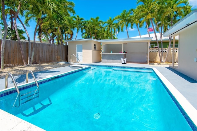 view of swimming pool with fence and a fenced in pool