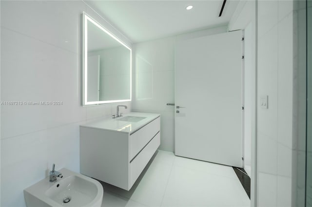 bathroom featuring vanity, tile patterned floors, and a bidet