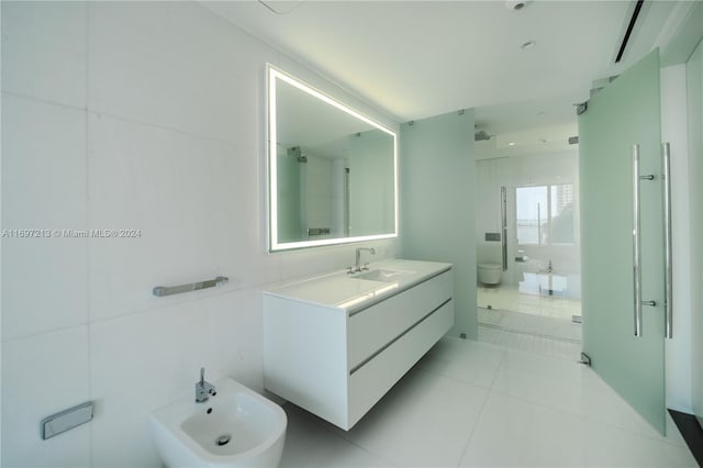 bathroom featuring vanity, a bidet, tile patterned flooring, toilet, and an enclosed shower