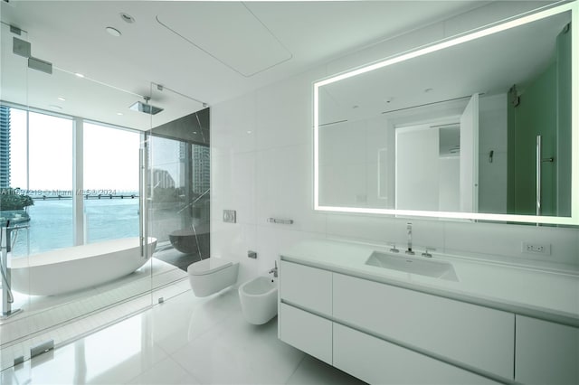 full bathroom with vanity, a bidet, tile patterned floors, a water view, and separate shower and tub