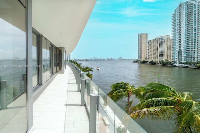 balcony featuring a water view