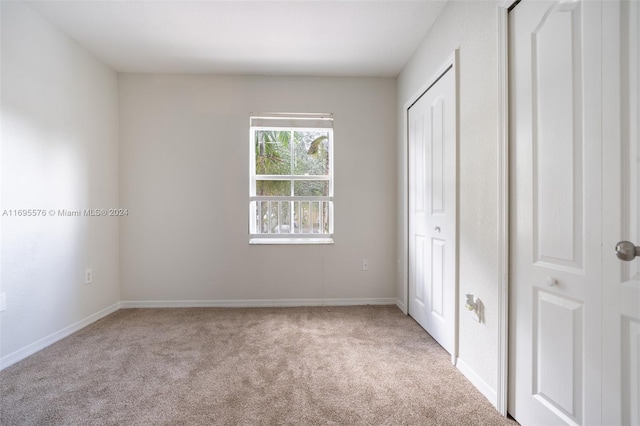 unfurnished bedroom featuring carpet