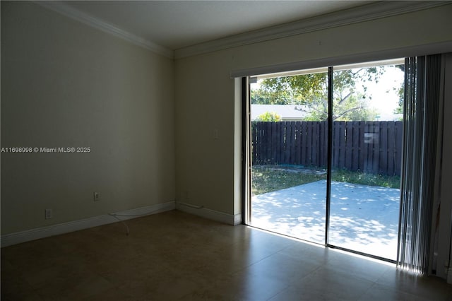 unfurnished room with baseboards and ornamental molding