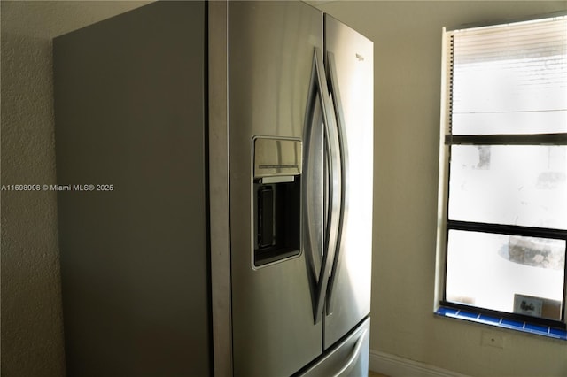 room details with stainless steel refrigerator with ice dispenser