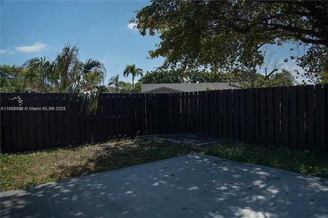 view of yard with a patio area and a fenced backyard