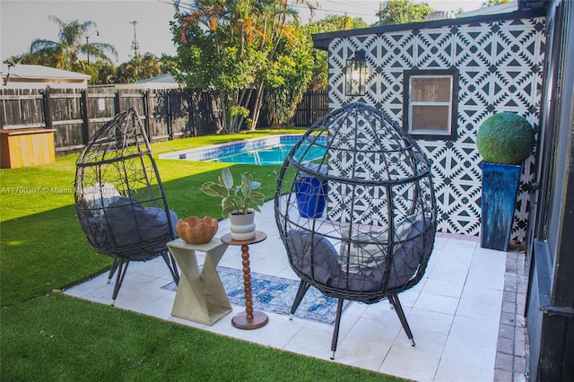 view of patio featuring a fenced in pool