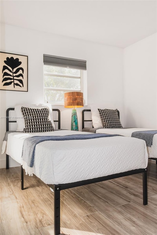 bedroom featuring wood-type flooring