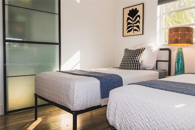 bedroom featuring dark hardwood / wood-style floors