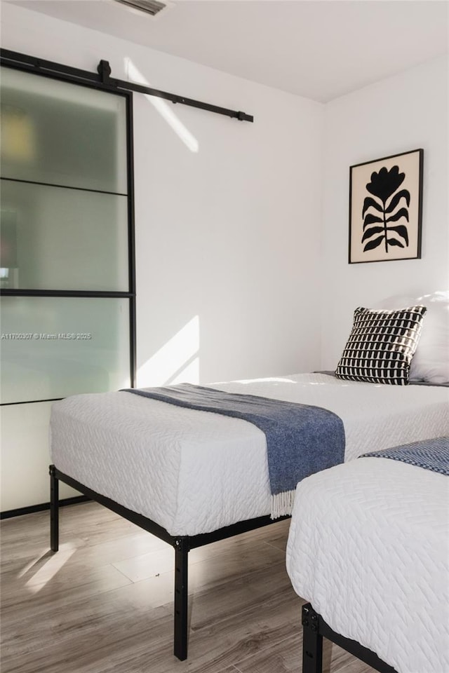 bedroom featuring hardwood / wood-style floors