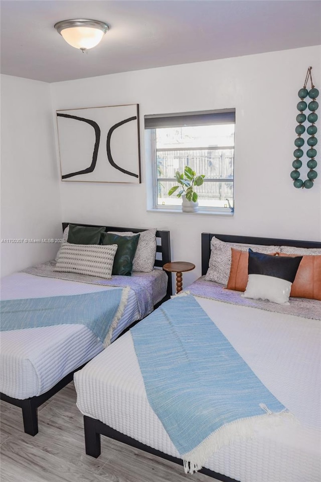 bedroom featuring wood-type flooring