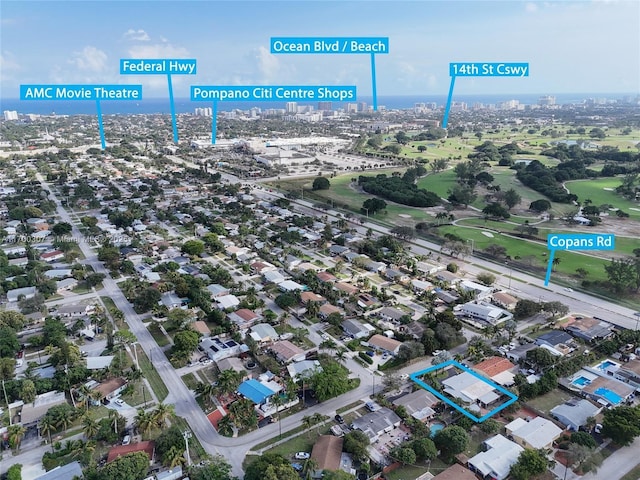 birds eye view of property featuring a city view