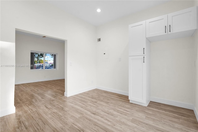 spare room with light wood-type flooring