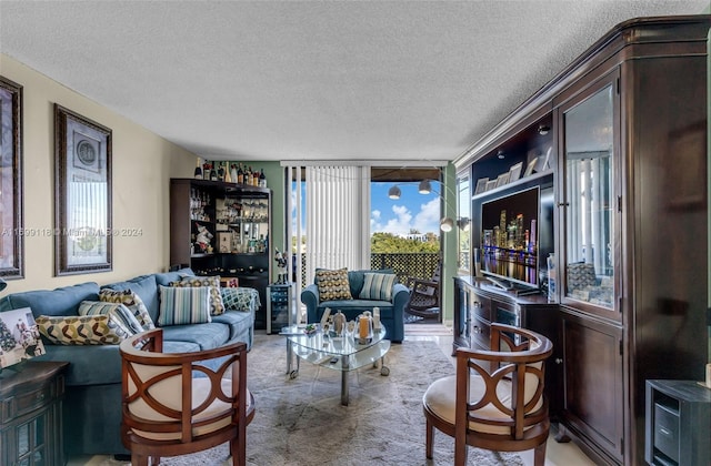 carpeted living room with a textured ceiling