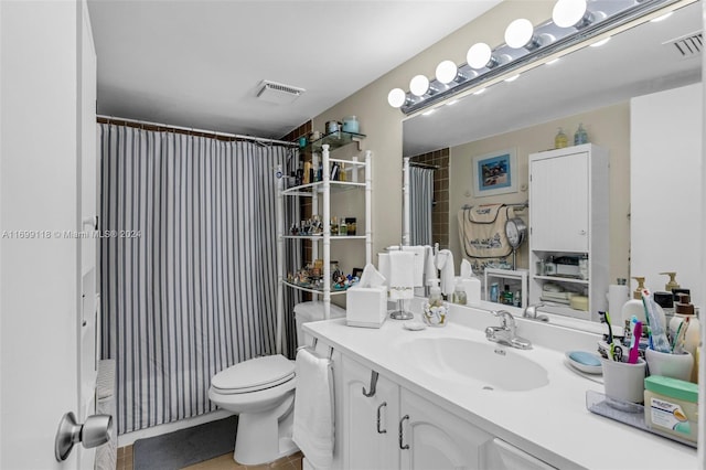 bathroom featuring tile patterned floors, vanity, toilet, and a shower with curtain