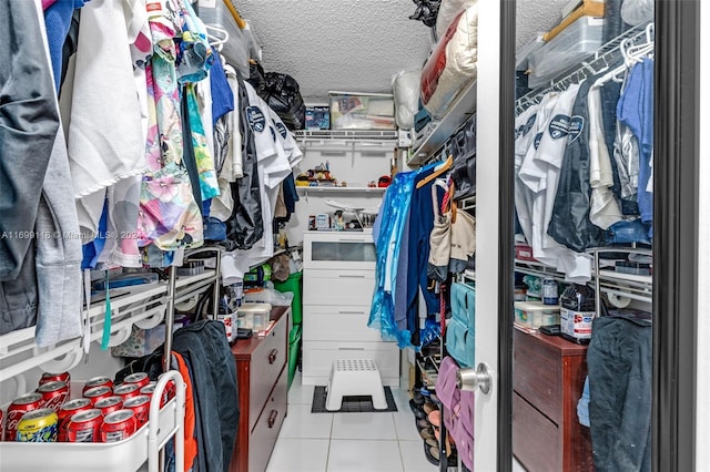 spacious closet with light tile patterned floors