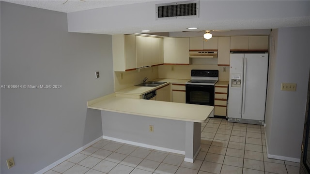 kitchen with kitchen peninsula, cream cabinetry, white appliances, and sink