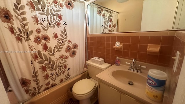 full bathroom featuring vanity, toilet, shower / bath combo with shower curtain, tile walls, and tasteful backsplash