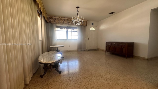 interior space with a notable chandelier