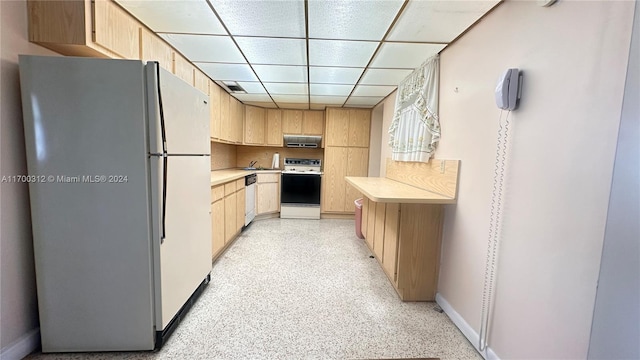 kitchen with a paneled ceiling, light brown cabinetry, exhaust hood, and white appliances