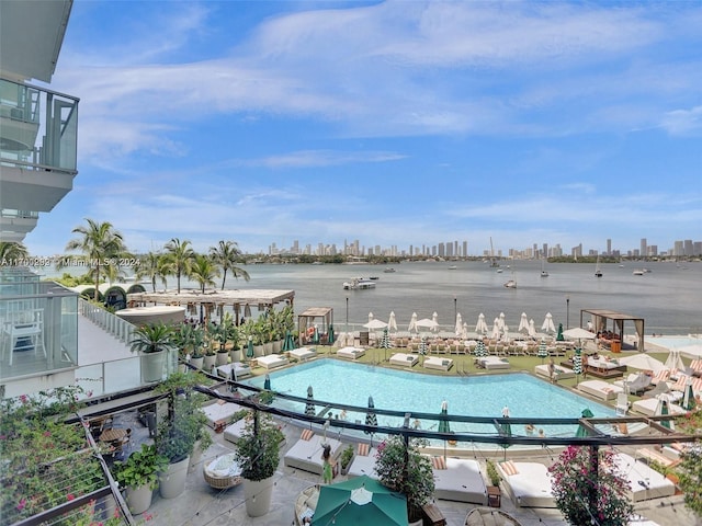 view of swimming pool with a water view