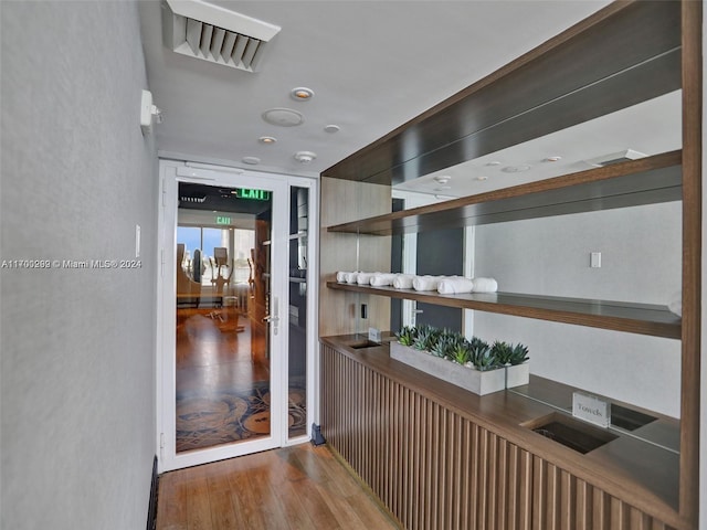 hallway featuring hardwood / wood-style flooring