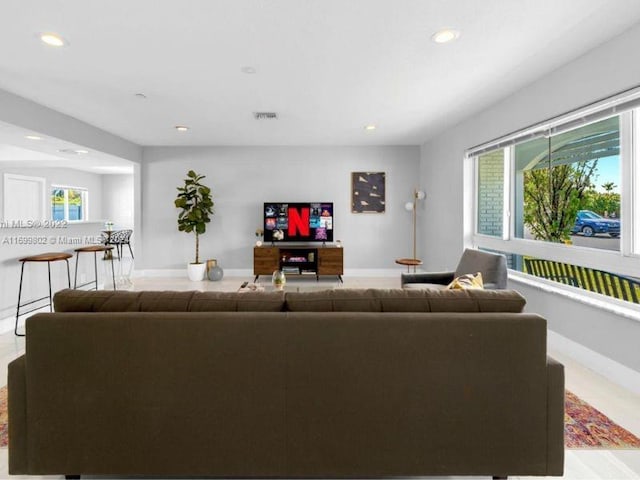 living room featuring a wealth of natural light