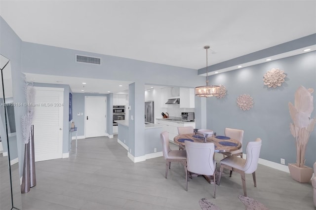 dining space with light wood-type flooring